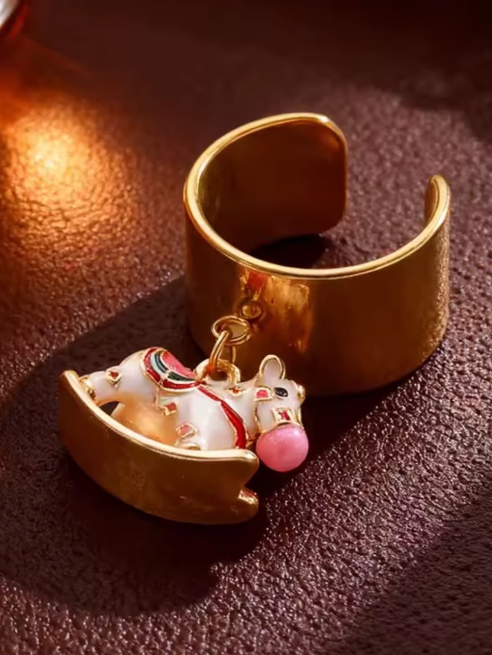 Anthropologie Gold-Tone Elephant Charm Cuff with Pink Accent